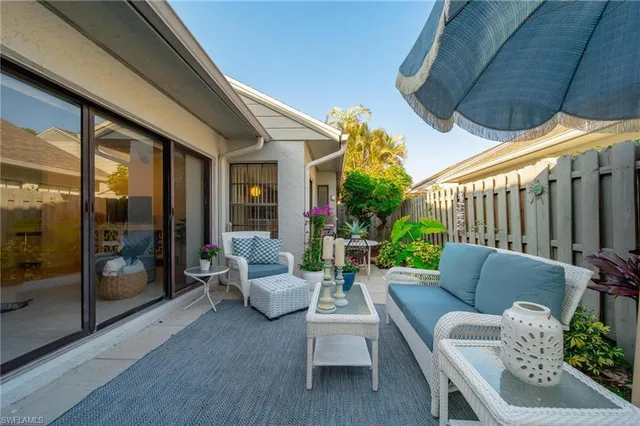 a outdoor living space with patio furniture and a potted plant