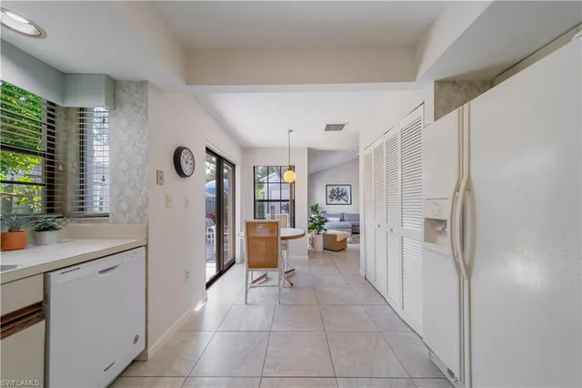 a very nice looking room with a large window and storage