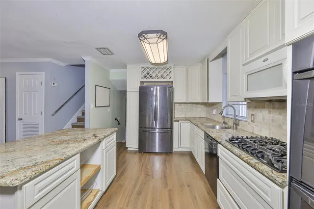 a kitchen with a stove oven and a refrigerator