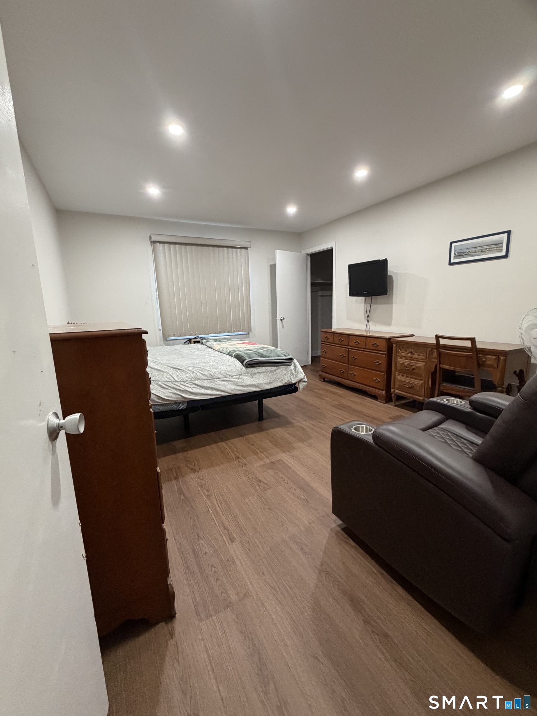 131 Florence Road, Unit 1C Branford, CT 06405 - Photo 11 of 18 a living room with furniture and a wooden floor