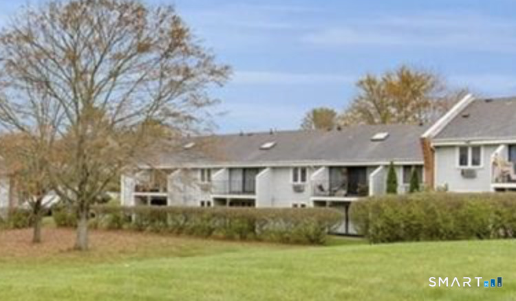131 Florence Road, Unit 1C Branford, CT 06405 - Photo 18 of 18 a front view of a house with a garden and yard