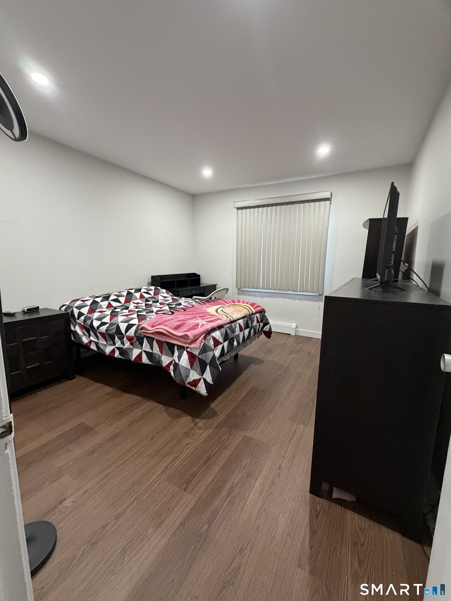 131 Florence Road, Unit 1C Branford, CT 06405 - Photo 10 of 18 a bedroom with a bed and window