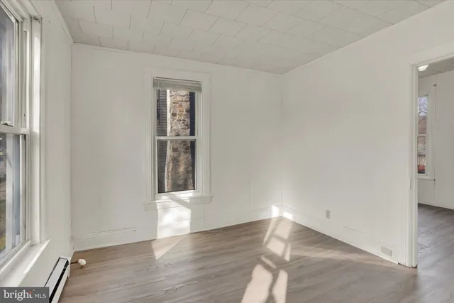 a view of an empty room with a fan