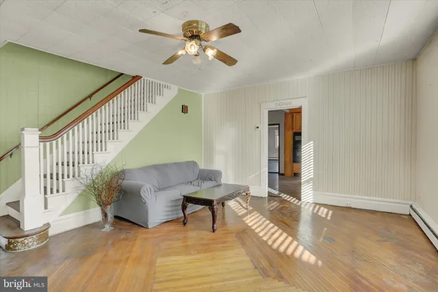 a bathroom with a toilet sink and a mirror