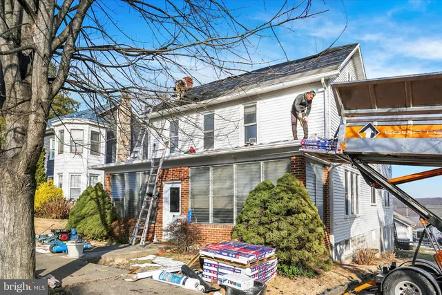 a view of a livingroom with wooden floor and a window