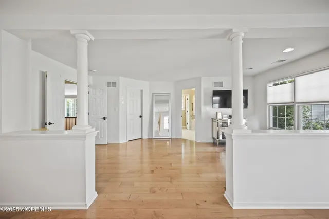 a bedroom with a bed window and a table