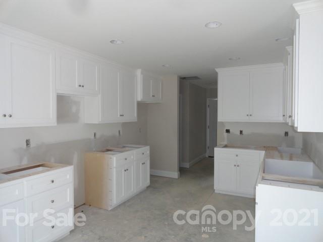 2508 Claremont Road Newton, NC 28658 - Photo 3 of 14 a kitchen with a sink a stove and cabinets