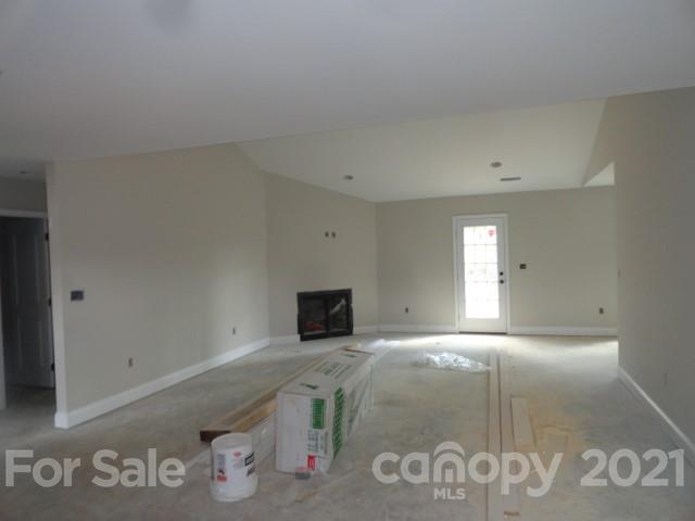 2508 Claremont Road Newton, NC 28658 - Photo 10 of 14 a view of empty room with window and fireplace