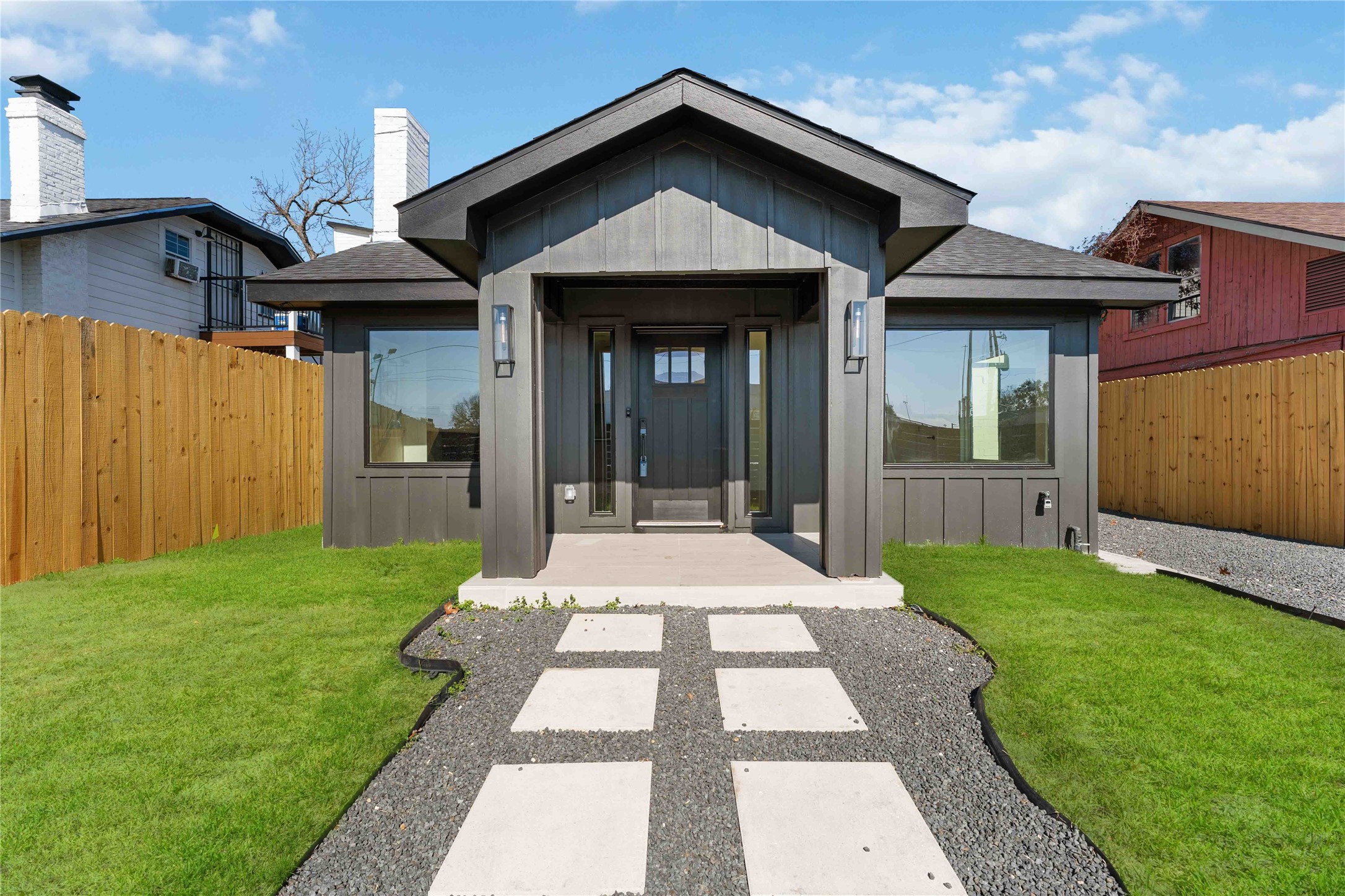 a front view of a house with a yard