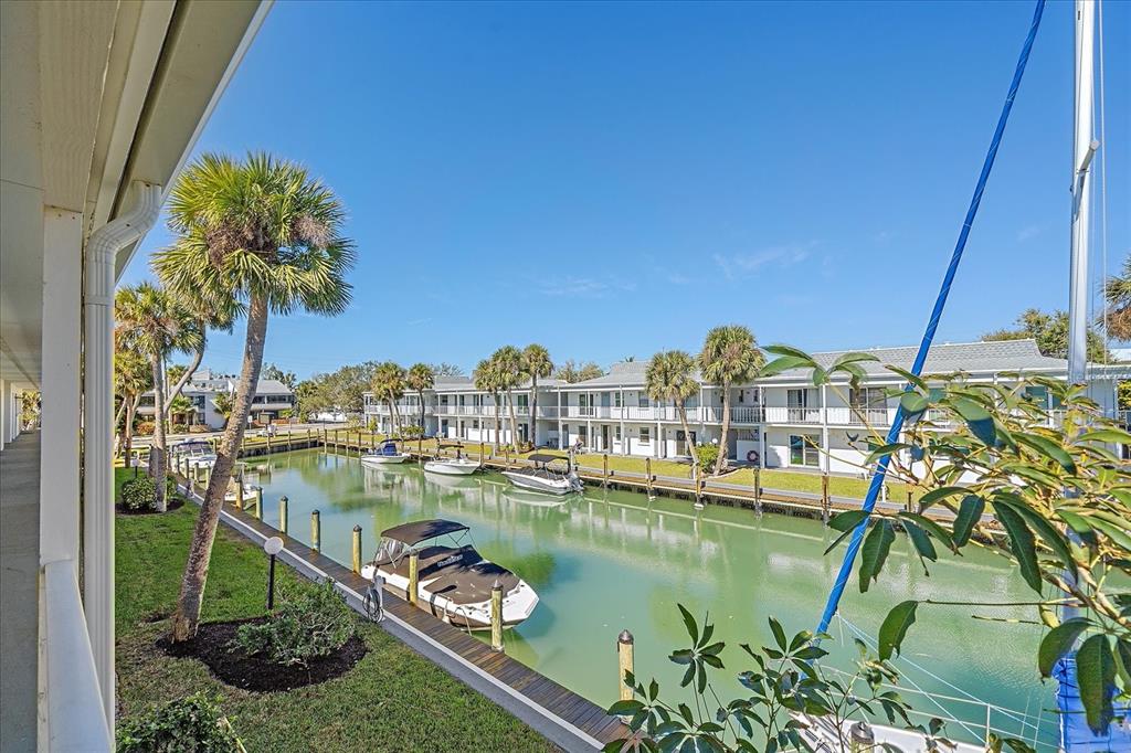 902 Gibbs Road, Unit 282 Venice, FL 34285 - Photo 19 of 19 a view of a lake with a building in the background