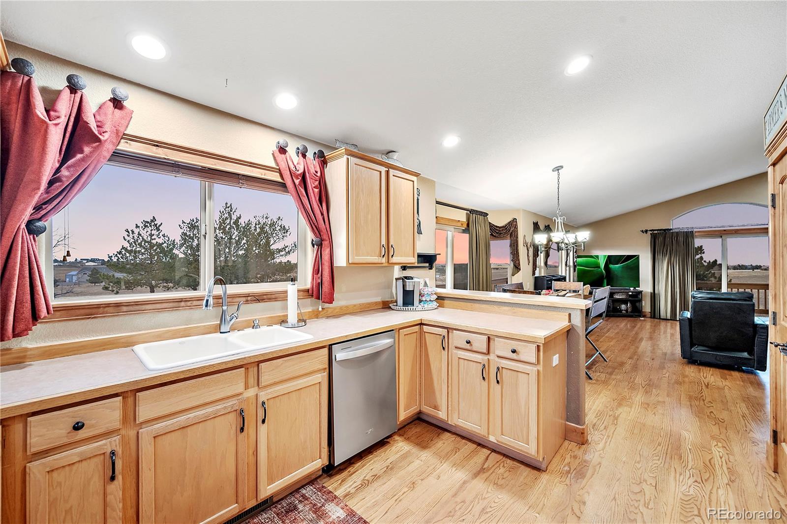 855 Gregory Circle Parker, CO 80138 - Photo 14 of 37 a kitchen with a sink stove and cabinets