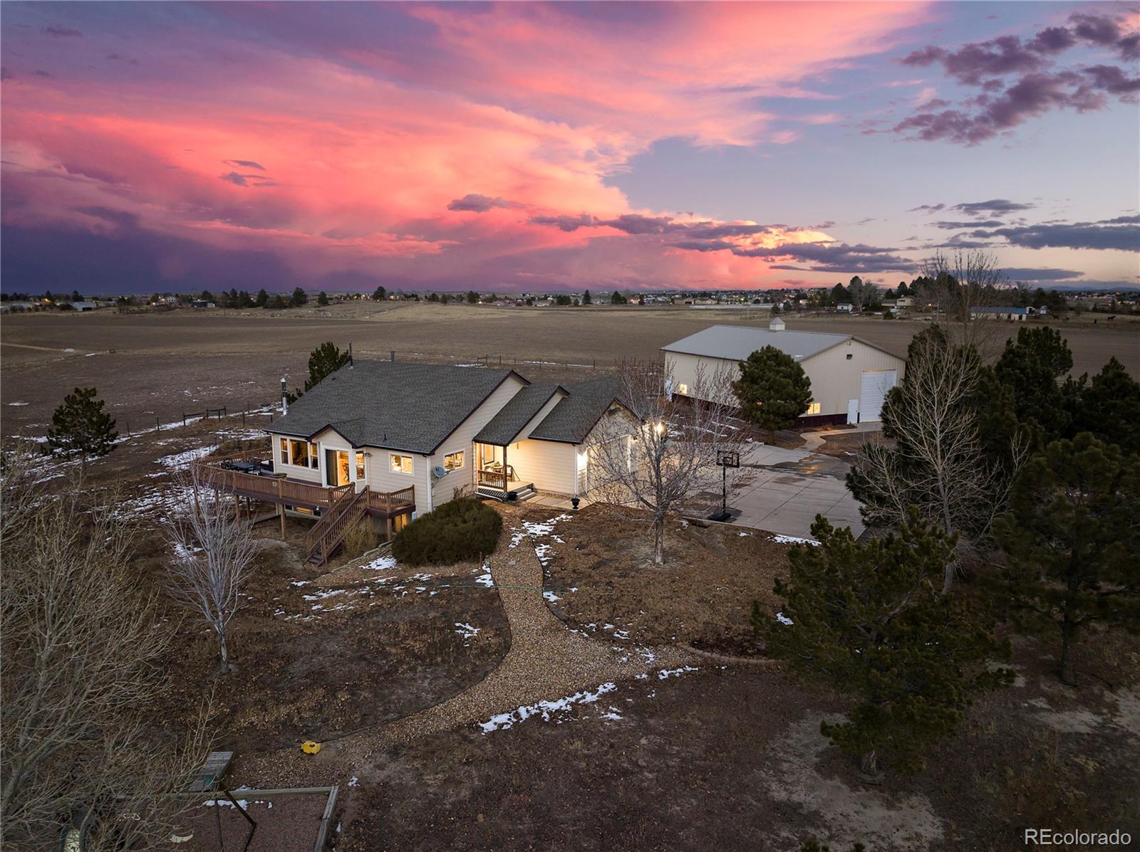 855 Gregory Circle Parker, CO 80138 - Photo 2 of 37 a view of a lake with a mountain