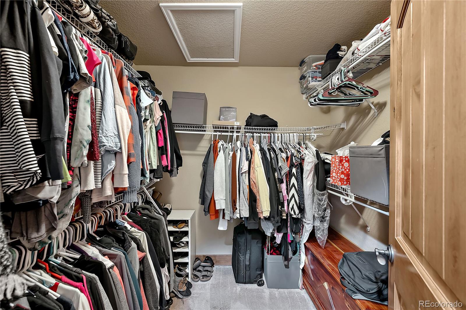 855 Gregory Circle Parker, CO 80138 - Photo 23 of 37 a view of walk in closet with clothes