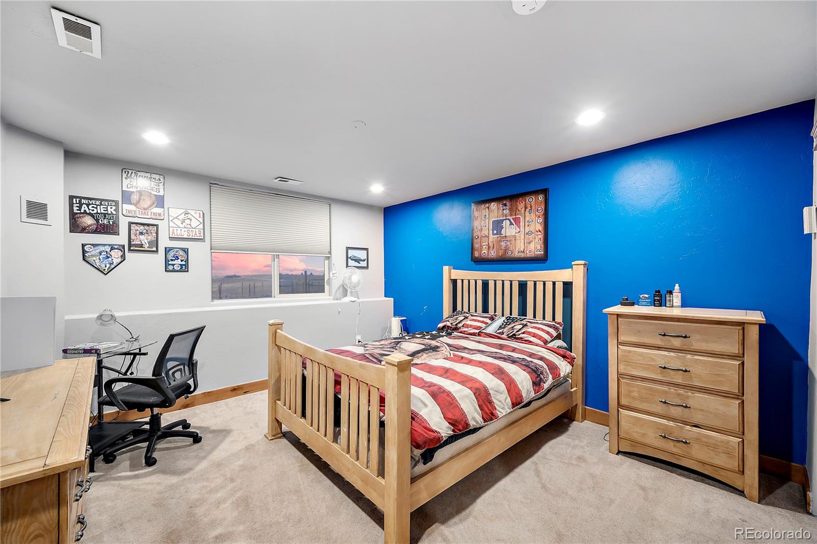 855 Gregory Circle Parker, CO 80138 - Photo 32 of 37 a bedroom with a bed and a desk