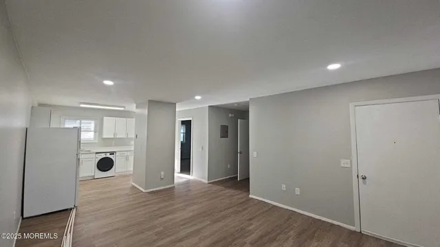 a view of kitchen space with wooden floor