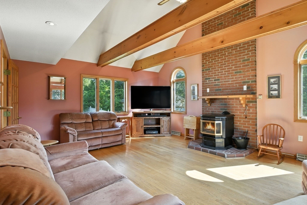77 Bowers Street West Springfield, MA 01089 - Photo 17 of 36 a living room with furniture and a flat screen tv