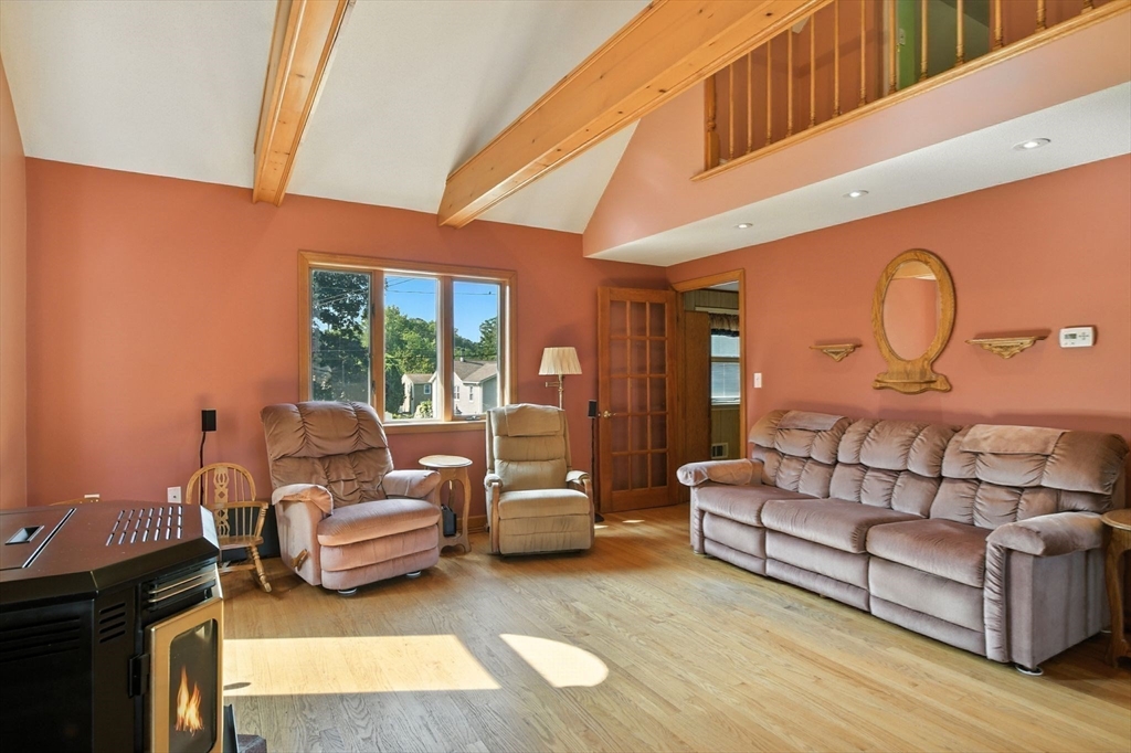 77 Bowers Street West Springfield, MA 01089 - Photo 19 of 36 a living room with furniture and a fireplace