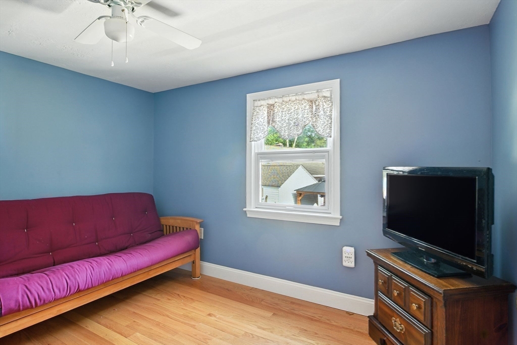 77 Bowers Street West Springfield, MA 01089 - Photo 28 of 36 a living room with furniture and a flat screen tv