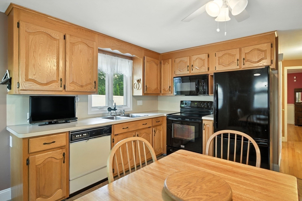 77 Bowers Street West Springfield, MA 01089 - Photo 8 of 36 a kitchen with stainless steel appliances granite countertop a stove a sink dishwasher a microwave oven with granite countertops and cabinets