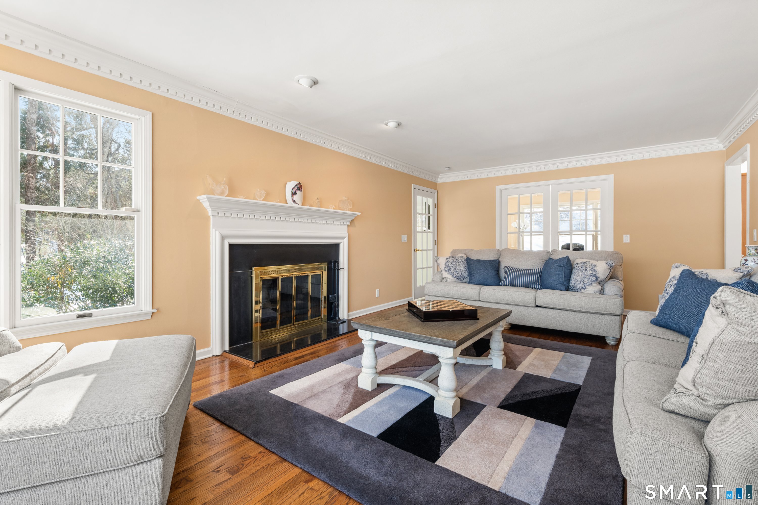 309 Sturges Ridge Road Wilton, CT 06897 - Photo 14 of 33 a living room with furniture and a fireplace