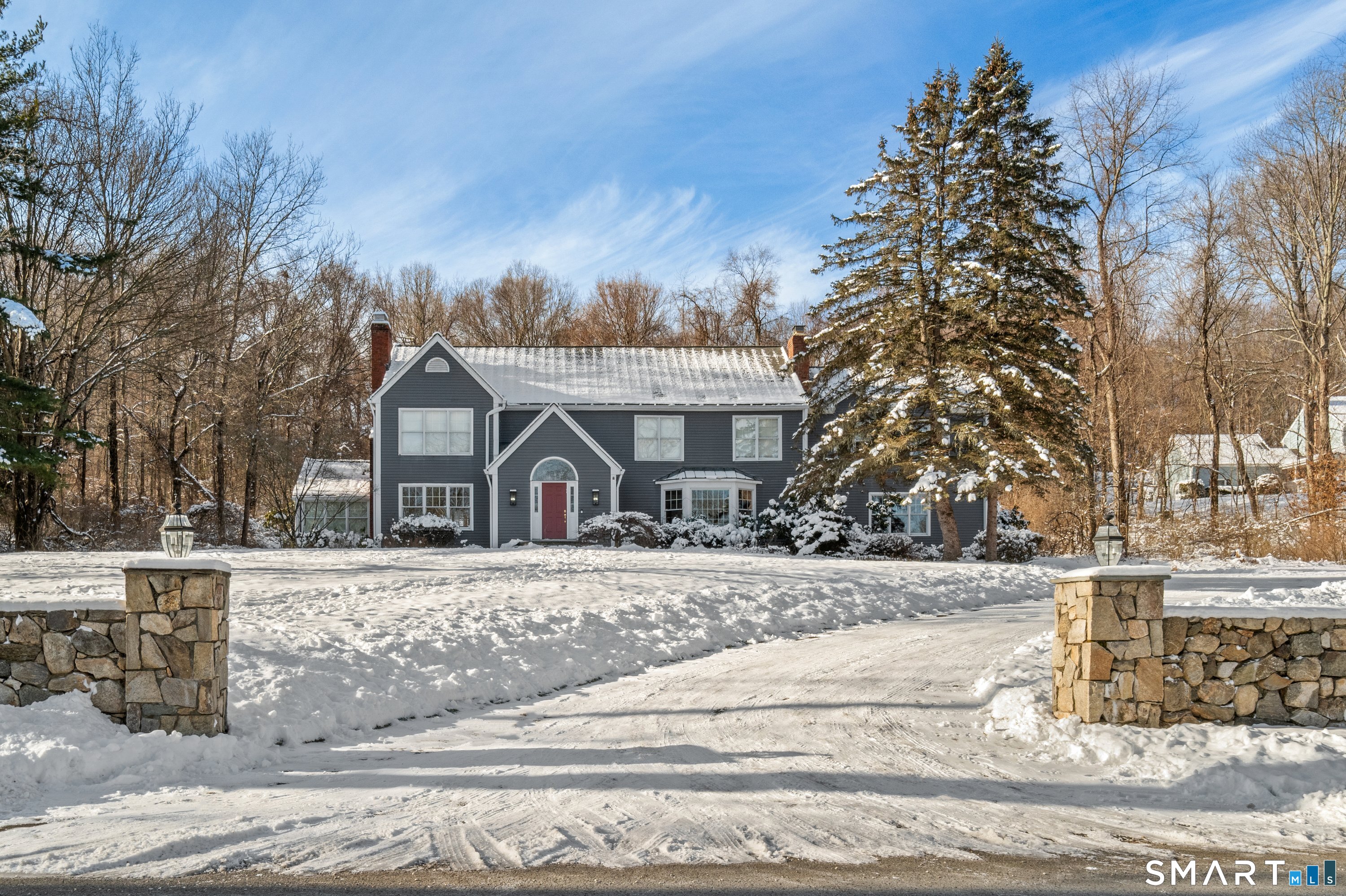 309 Sturges Ridge Road Wilton, CT 06897 - Photo 21 of 33 a front view of a house with a yard