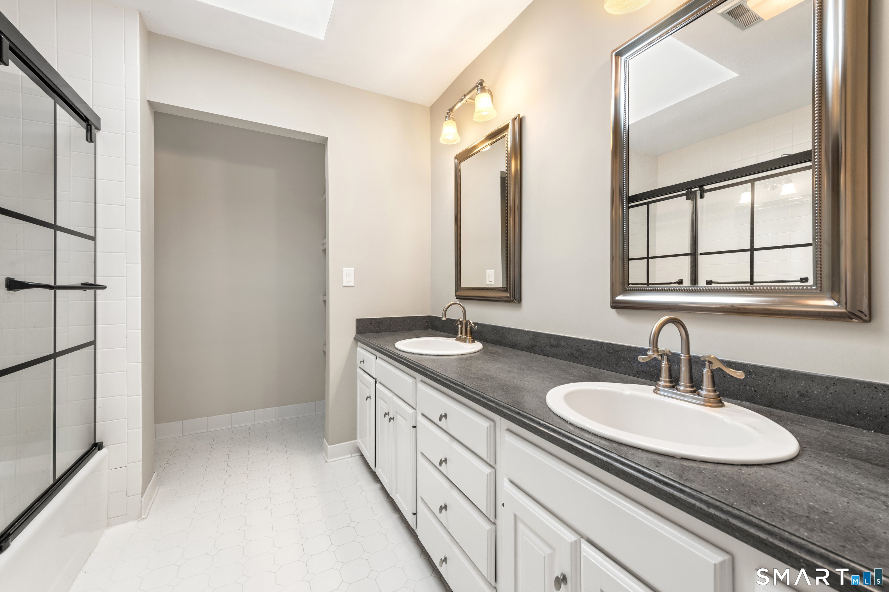 309 Sturges Ridge Road Wilton, CT 06897 - Photo 31 of 33 a bathroom with a sink and a mirror