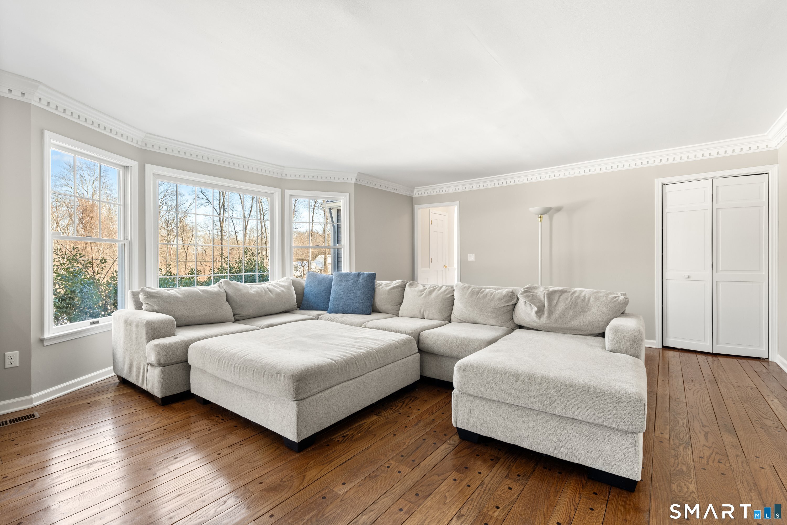 309 Sturges Ridge Road Wilton, CT 06897 - Photo 8 of 33 a living room with furniture and a large window