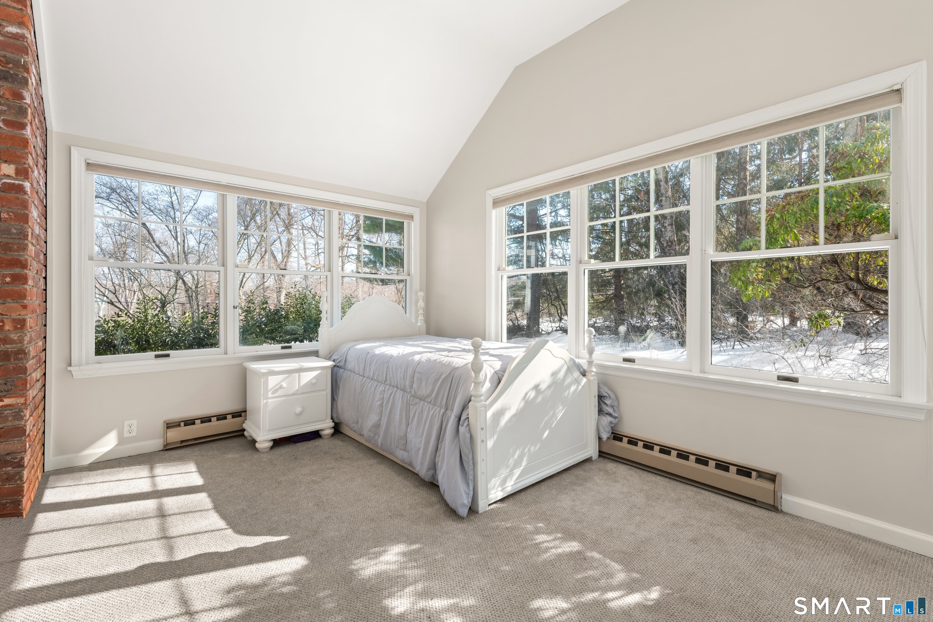 309 Sturges Ridge Road Wilton, CT 06897 - Photo 10 of 33 a bed room with a bed and a large window