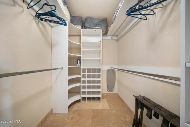 a large kitchen with stainless steel appliances granite countertop a refrigerator and a sink