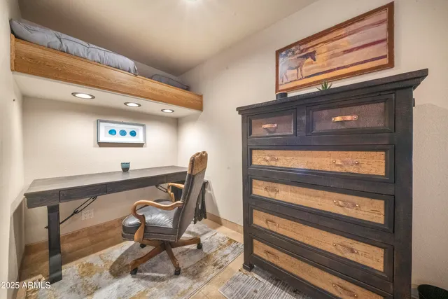 a view of a patio with table and chairs