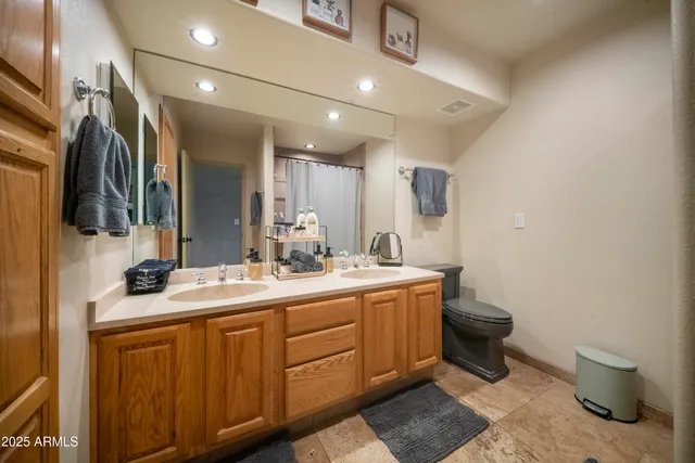 a view of a patio with table and chairs potted plants with wooden floor