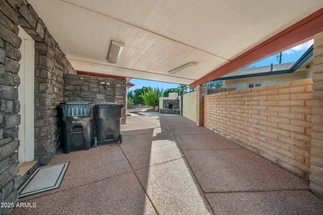 an aerial view of a houses with a swimming pool