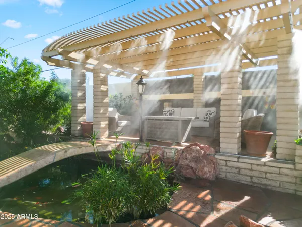 a view of a swimming pool with a patio