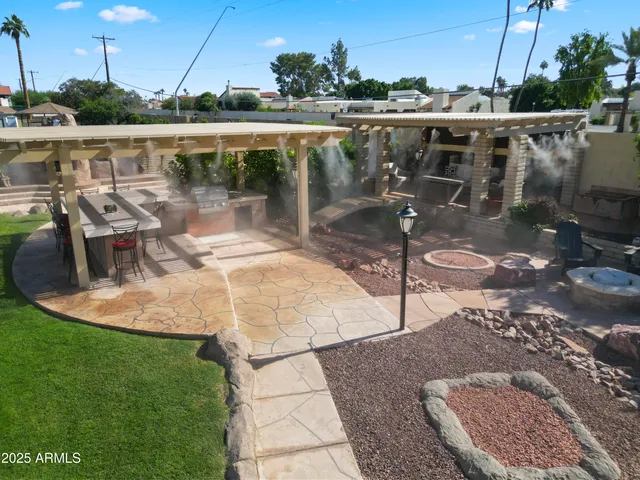 a terrace with outdoor seating and oven