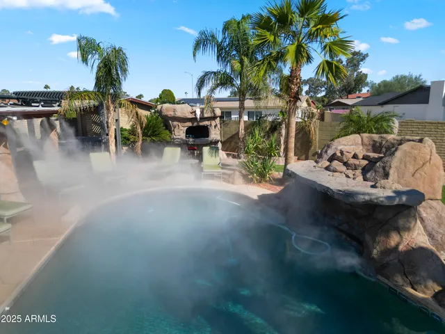 a bathroom with a toilet sink and shower curtain