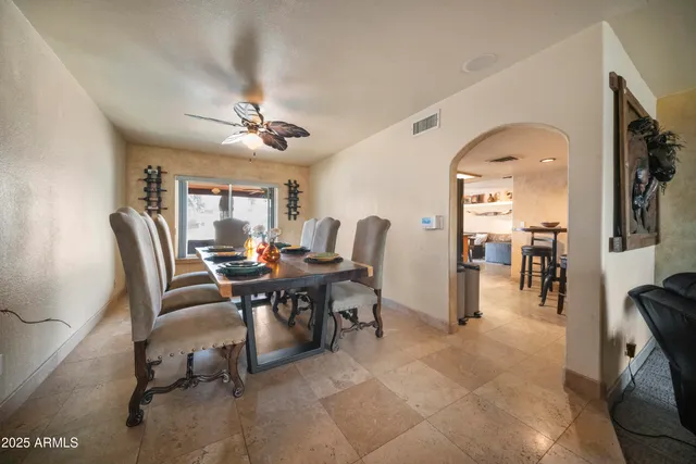 a kitchen with stainless steel appliances granite countertop a sink a stove and a refrigerator
