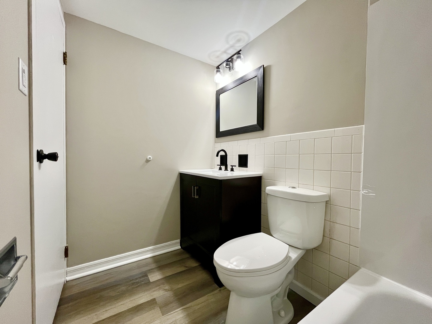 9725 Karlov Avenue, Unit 501 Oak Lawn, IL 60453 - Photo 13 of 17 a bathroom with a toilet sink and mirror