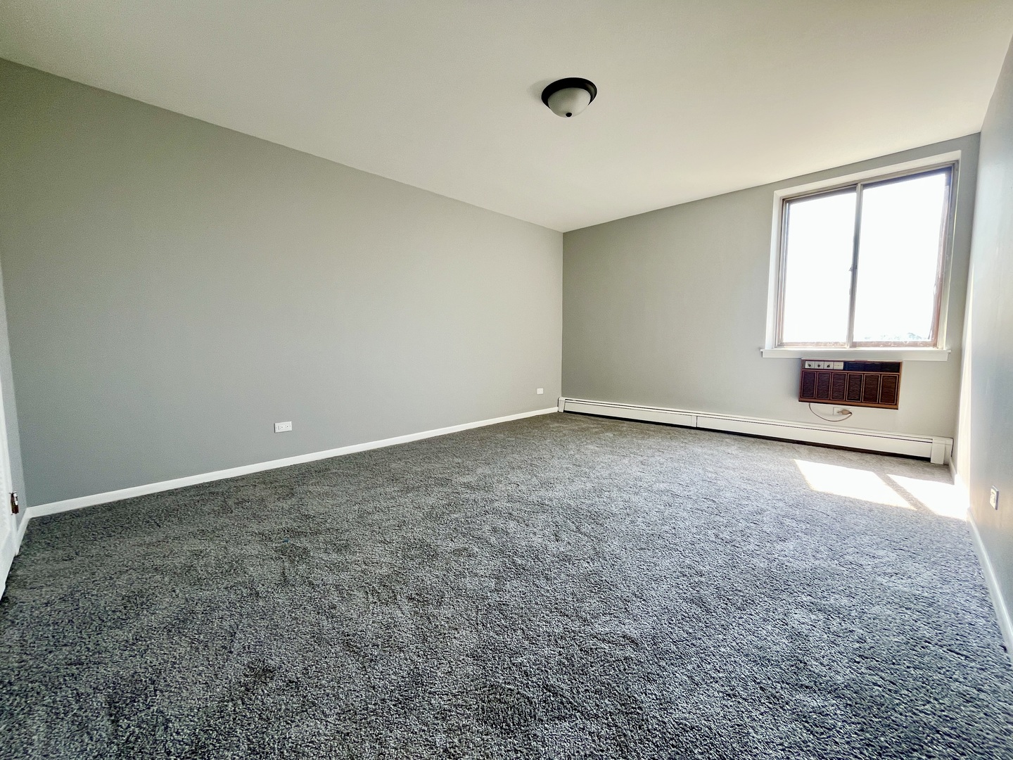 9725 Karlov Avenue, Unit 501 Oak Lawn, IL 60453 - Photo 6 of 17 an empty room with a empty space and windows