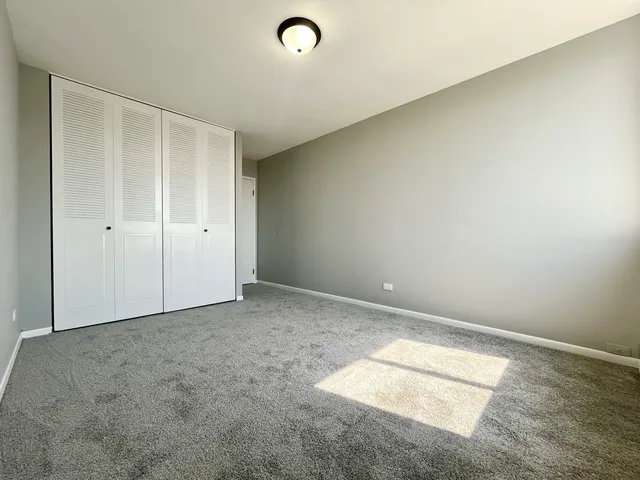 an empty room with a empty space and windows