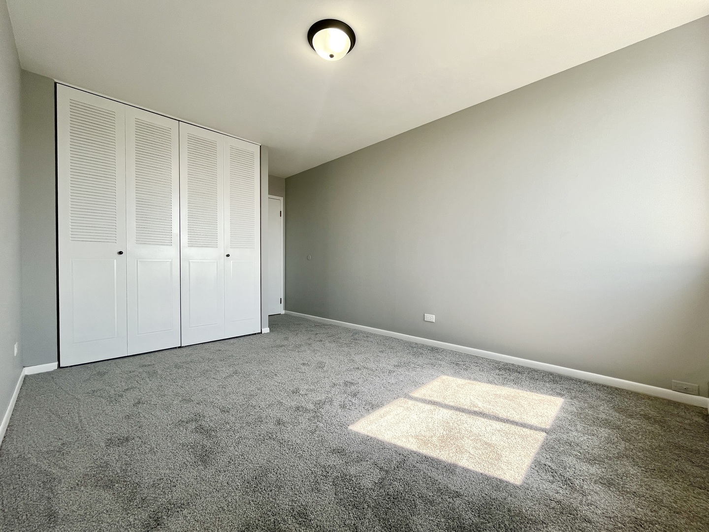 9725 Karlov Avenue, Unit 501 Oak Lawn, IL 60453 - Photo 8 of 17 an empty room with a empty space and windows
