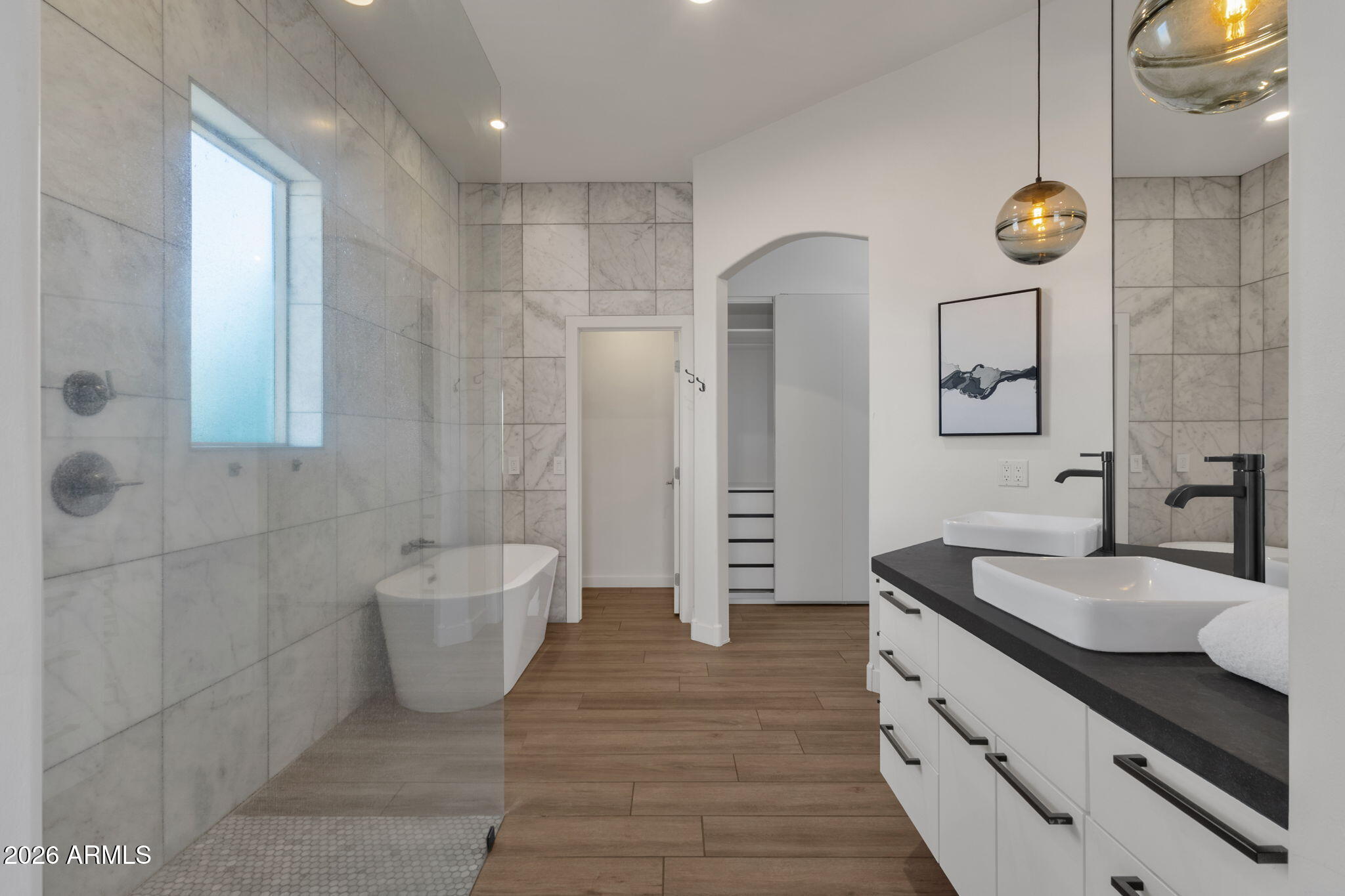14604 East Peak View Road Scottsdale, AZ 85262 - Photo 23 of 55 a spacious bathroom with a double vanity sink a mirror and a bathtub
