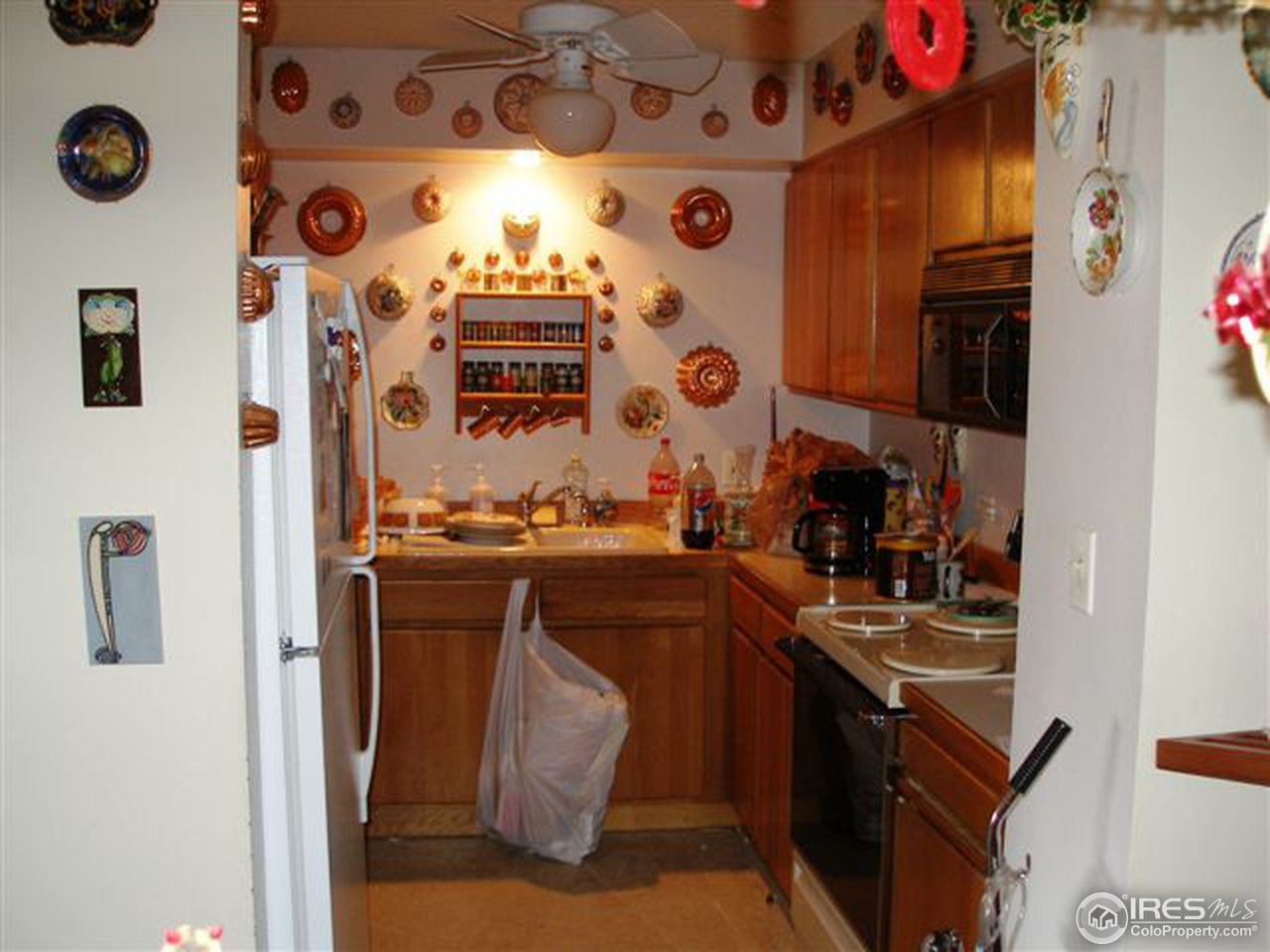 1850 Folsom Street, Unit 1007 Boulder, CO 80302 - Photo 6 of 13 a kitchen with a sink and cabinets