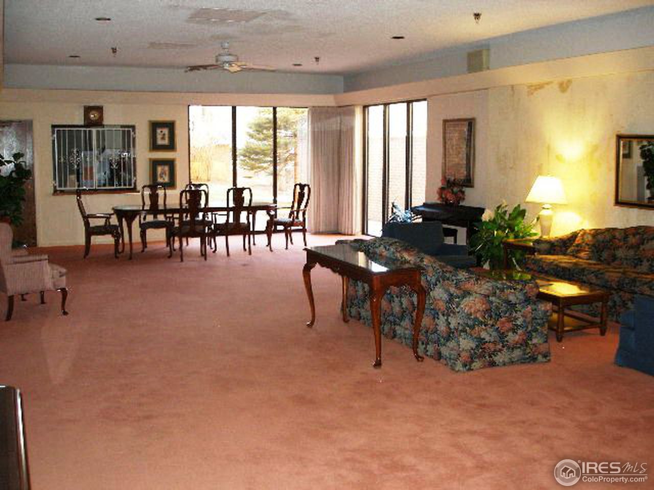 1850 Folsom Street, Unit 1007 Boulder, CO 80302 - Photo 10 of 13 a living room with furniture and large windows