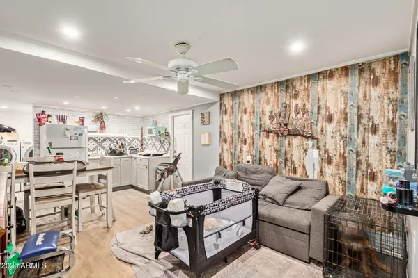 a living room with furniture and a chandelier