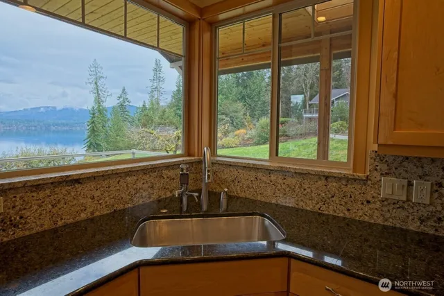 a sink sitting next to a window
