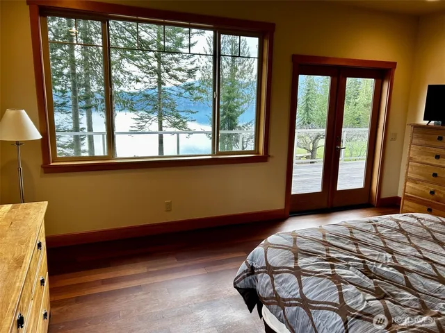 a bedroom with a bed and window