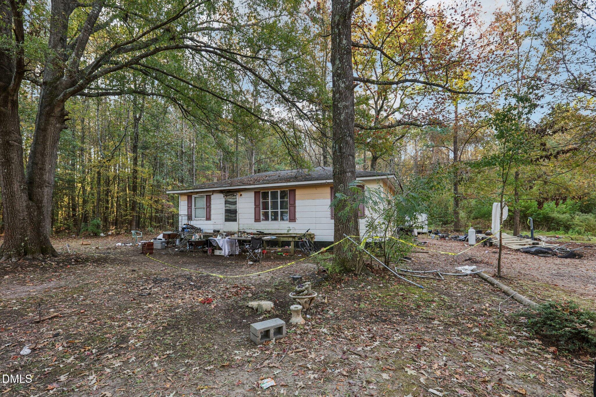 1117 Leach Street Raleigh, NC 27603 - Photo 2 of 3 a view of a house with a yard and sitting area
