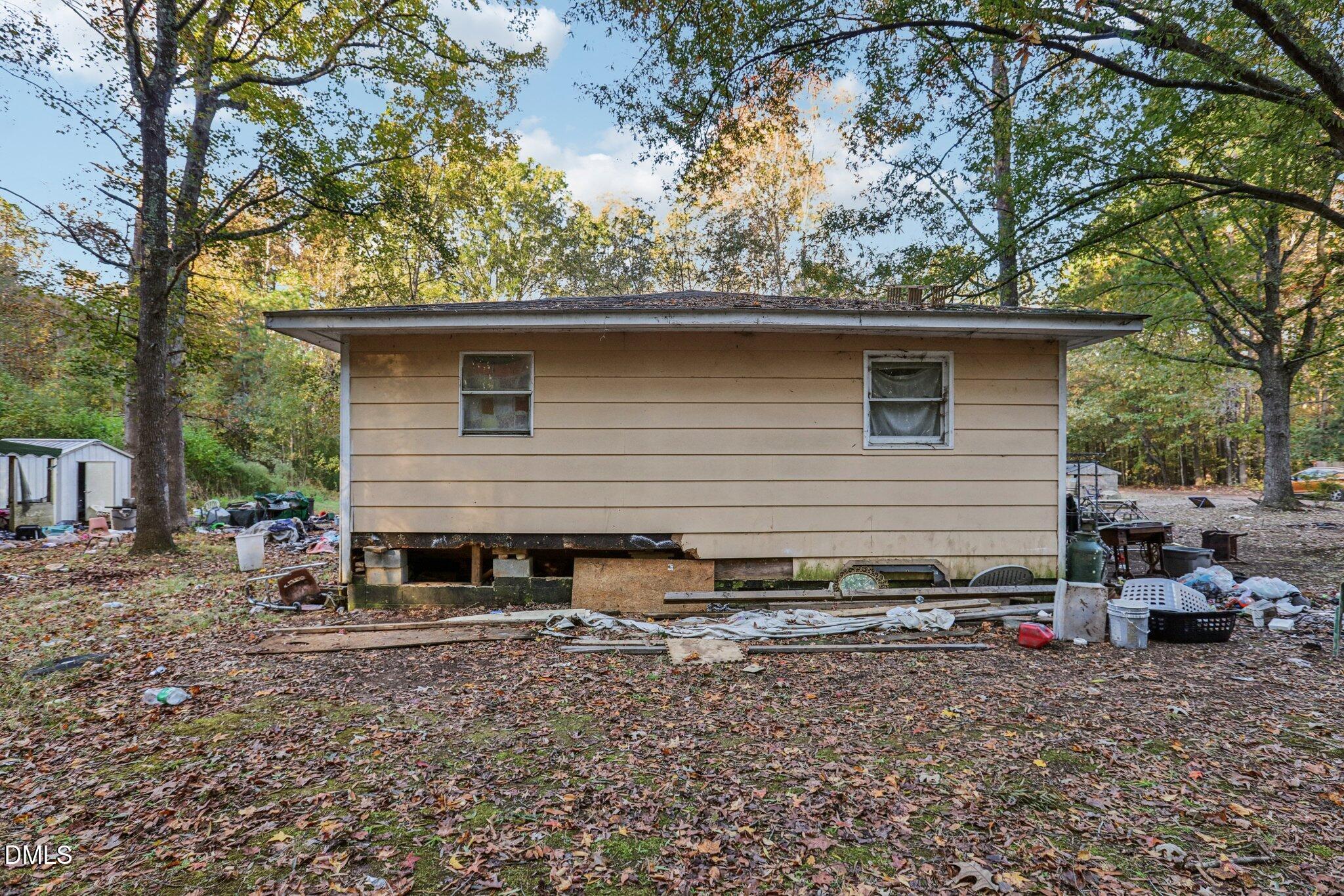 1117 Leach Street Raleigh, NC 27603 - Photo 3 of 3 a backyard of a house with barbeque oven