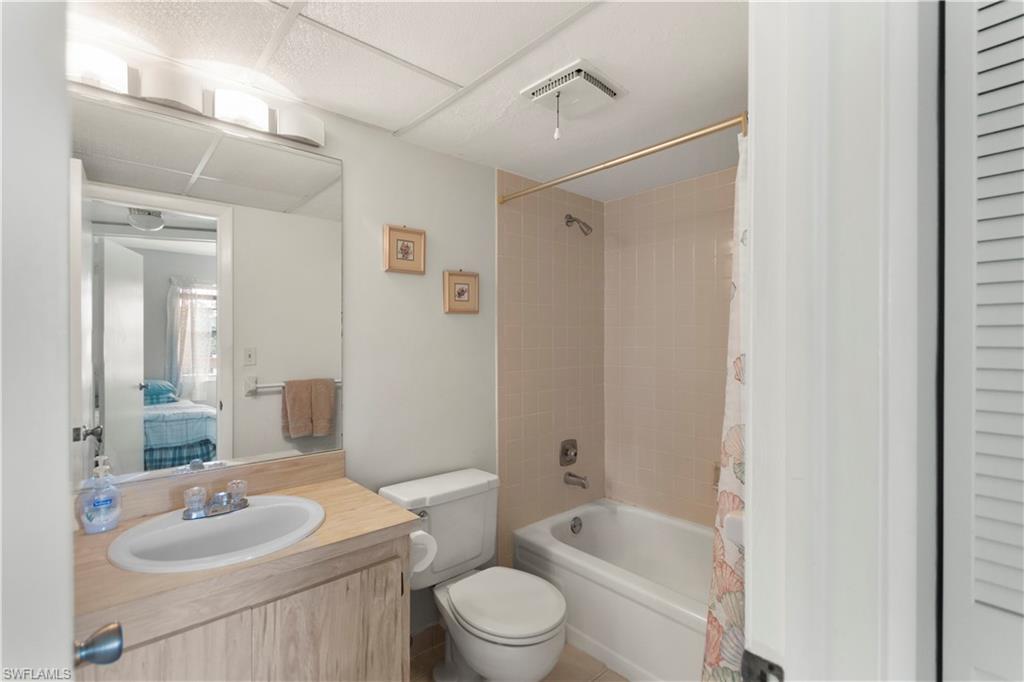 499 Forest Lakes Boulevard, Unit 2304 Naples, FL 34105 - Photo 17 of 21 a bathroom with a sink toilet tub and shower
