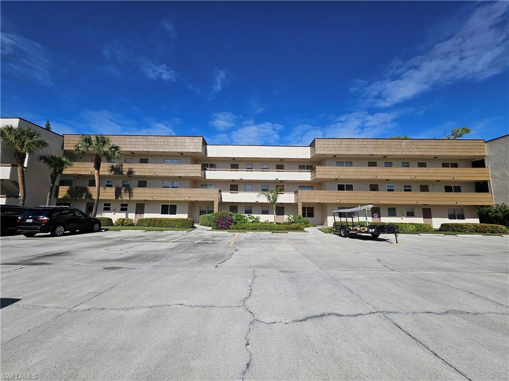 499 Forest Lakes Boulevard, Unit 2304 Naples, FL 34105 - Photo 21 of 21 a view of a building with a street